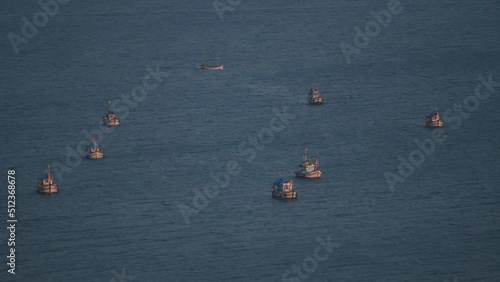 Full frame shot of fishing boats in the Arabian sea at Goa in India. Boats as seen from the top of the hill in Goa. Fishing boats in the sea. Boats fishing in the Arabian sea.