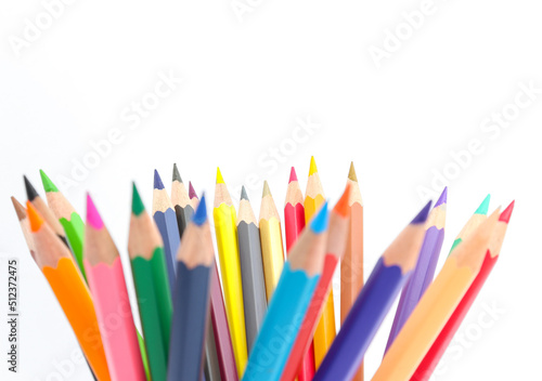 colored pencils lined on a white background