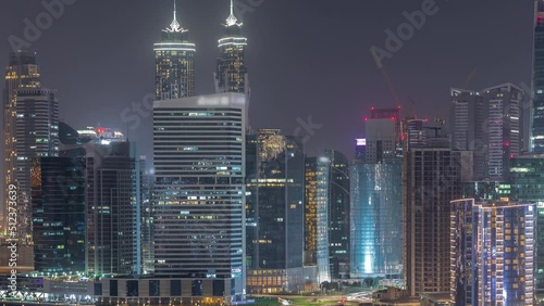 Wallpaper Mural Cityscape of skyscrapers in Dubai Business Bay with peninsula on water canal aerial night timelapse. Modern skyline with illuminated towers and waterfront. A center of international business Torontodigital.ca