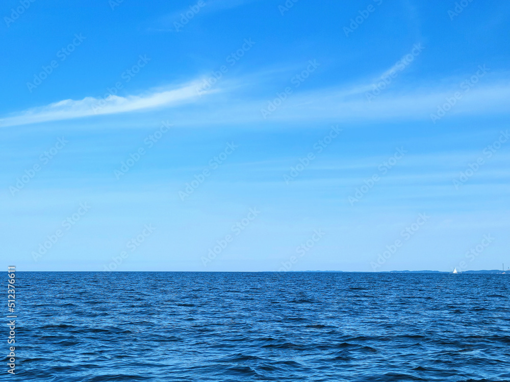Blue Lake Michigan water with horizon and summer sky