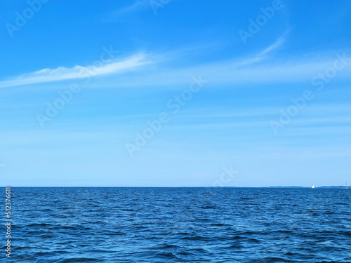 Blue Lake Michigan water with horizon and summer sky