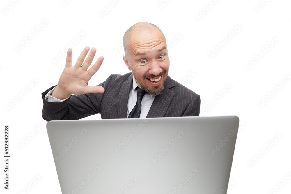 Funny smiling man in suit looking at laptop screen. Businessman holding video conference with friend isolated on white backfground. Funny smiling man in suit looking at laptop screen. Businessman holding video conference with friend isolated on white backfground.