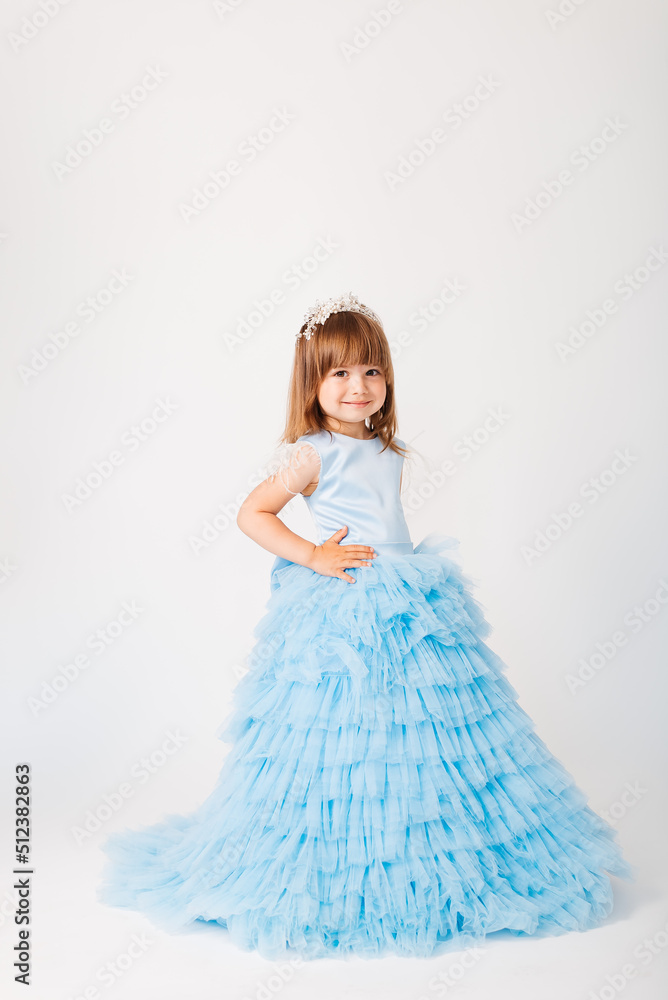 Beautiful little girl in a blue puffy dress Beautiful little girl in a blue puffy dress