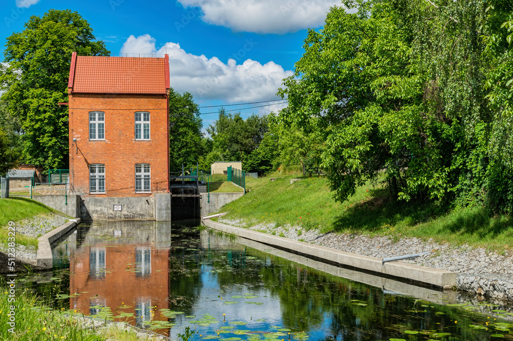 Obraz premium Old brick water mill on the river