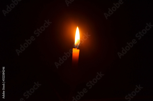 burning candle in the dark