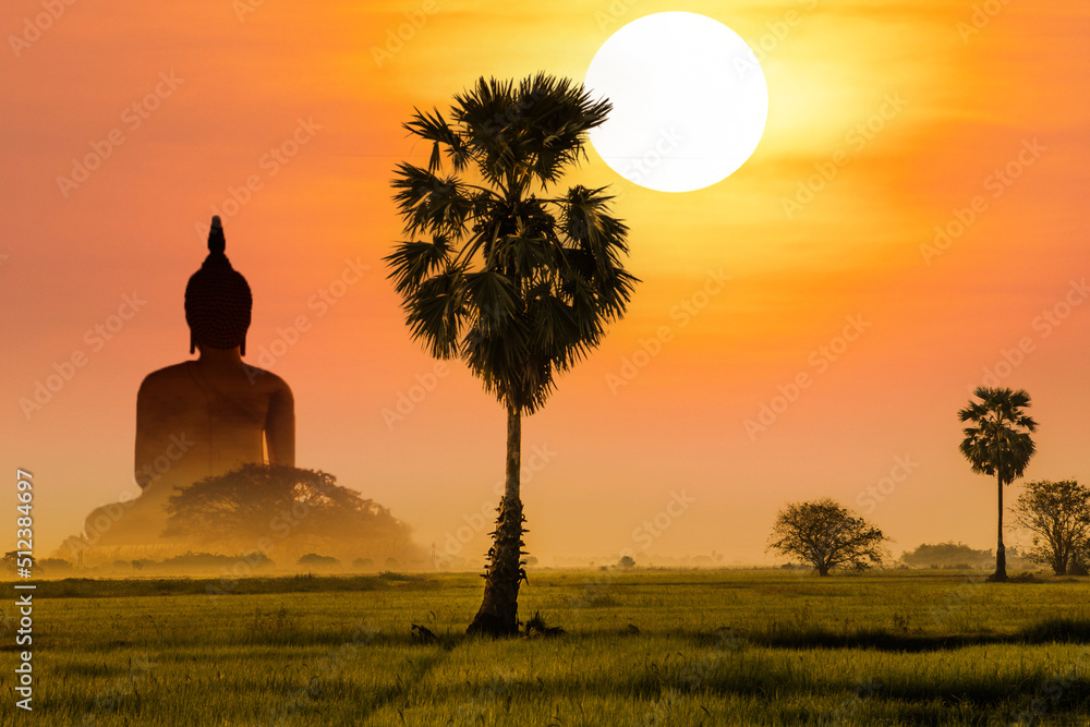 Scenery sunrise in the morning. Big buddha statue at Wat muang, Thailand.