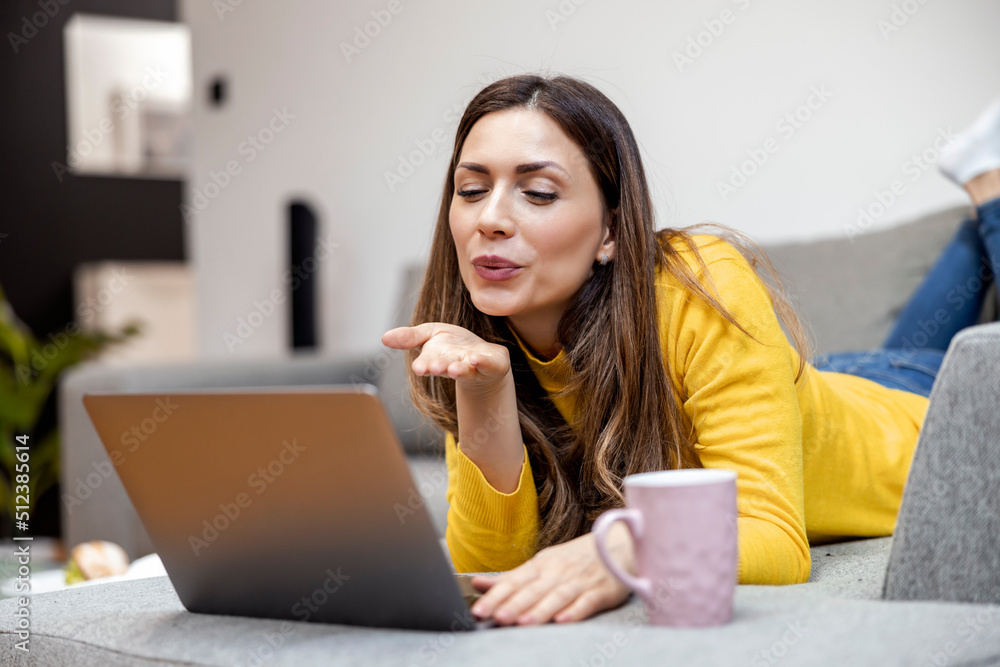 Woman using her laptop at home Woman using her laptop at home