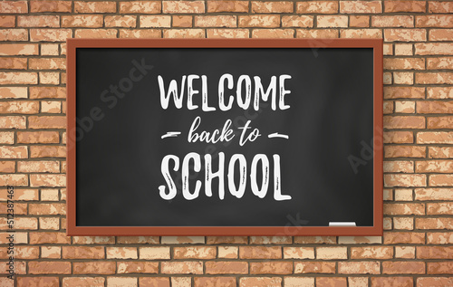 Welcome back to school banner. Realistic black chalkboard with chalk text on brown brick wall in classroom. Vector illustration for web, poster mockup, school class design background, card.