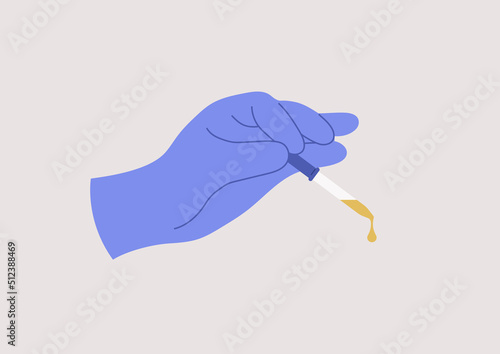 A hand using an eye dropper, a medical concept