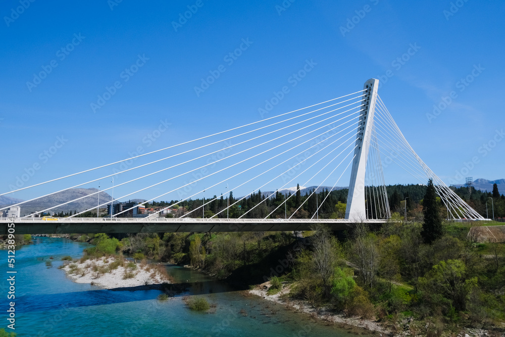 suspension millennium bridge over the Moraca river, Podgorica, Montenegro. Golden gate bridge in San Francisco copy. transportation road, summer urban cityscape suspension millennium bridge over the Moraca river, Podgorica, Montenegro. Golden gate bridge in San Francisco copy. transportation road, summer urban cityscape