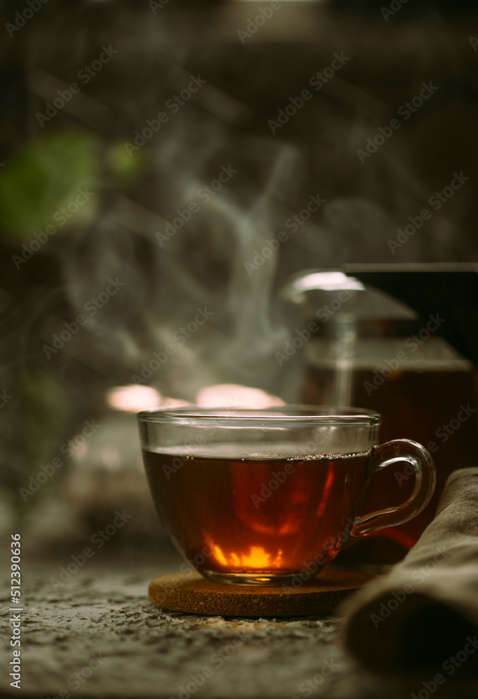 Hot black tea on a dark background Hot black tea on a dark background