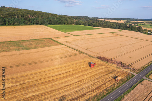 Bird's-eye view of a combine harvester harvesting grain in Taunus/Germany