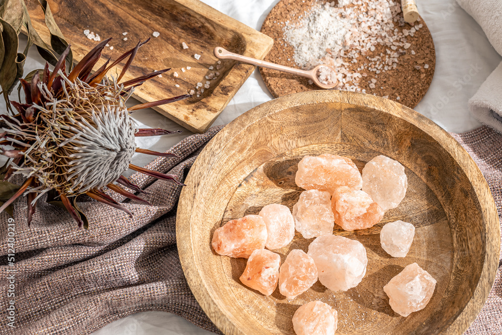 Spa composition with pieces of sea salt in a wooden plate. Spa composition with pieces of sea salt in a wooden plate.