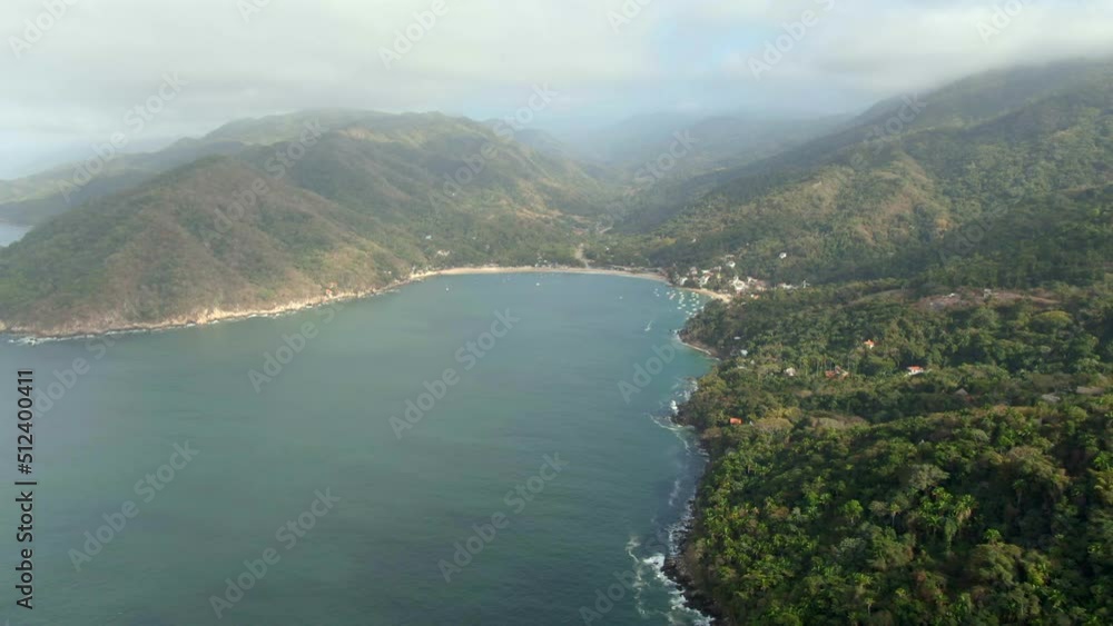 Vista Of Tropical Forest Mountains At Yelapa Beach Near Puerto Vallarta In Jalisco, Mexico. Aerial Wide Shot Vista Of Tropical Forest Mountains At Yelapa Beach Near Puerto Vallarta In Jalisco, Mexico. Aerial Wide Shot