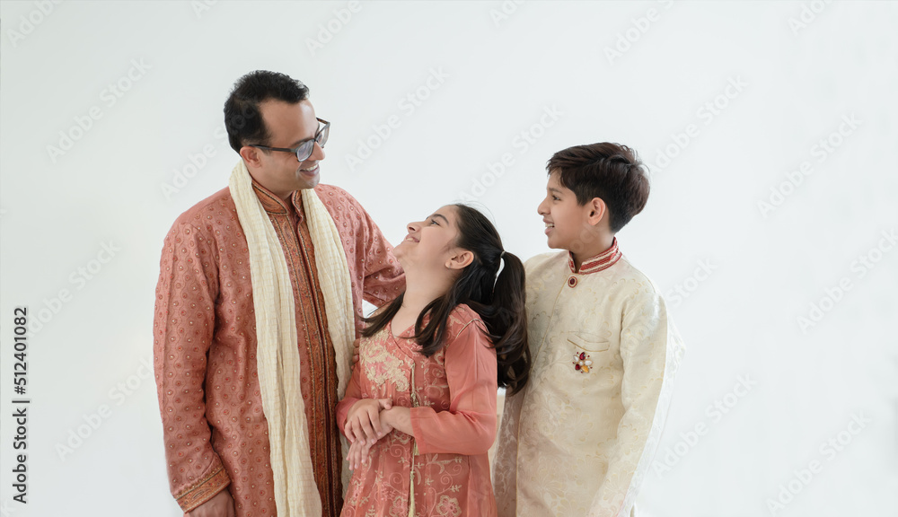 Portrait of happy Indian family standing over white background. Smart ...