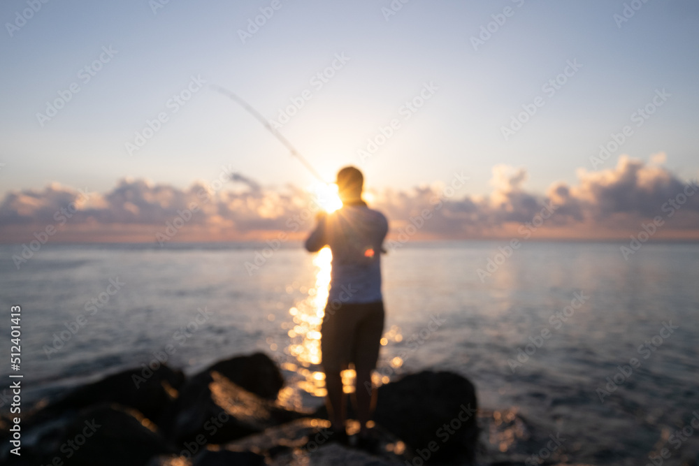 Fisherman catches morning rays