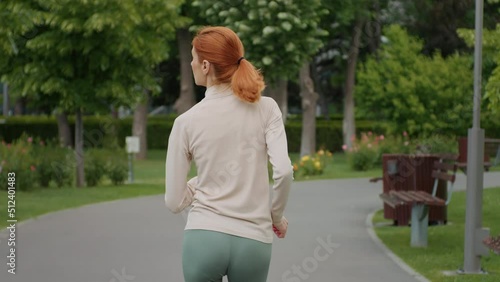 Back view of anorexic woman who started doing jogging in the morning. Anorexia concept. Slimmy physical condition. Anorexic girl doing fitness training for muscle growth. Skinny body, weight loss.