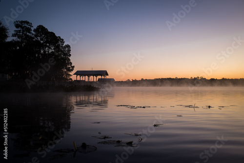 Print op canvas Early morning boathouse at the lake