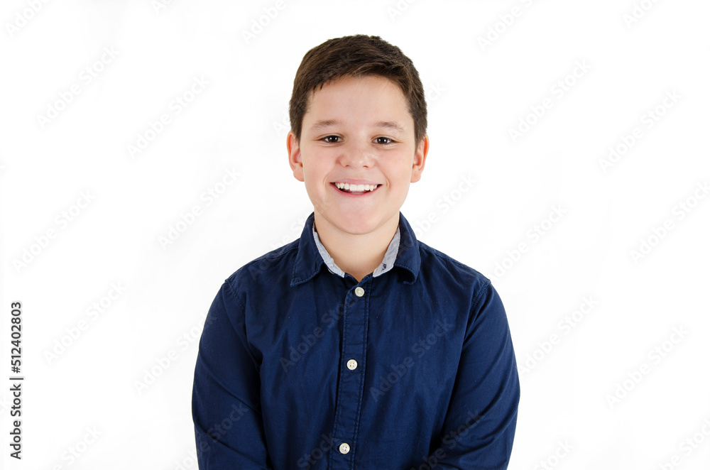 Photo of adorable smiling young boy looking at camera.Isolated on white background. Studio shot Photo of adorable smiling young boy looking at camera.Isolated on white background. Studio shot