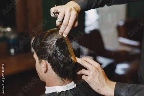 Stylish man sitting in a barbershop