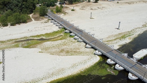 problems of drought and aridity in the almost waterless Po river with large expanses of sand and no water - climate change and global warming, Drone view in Ponte delle chiatte Bereguardo Lombardy  photo