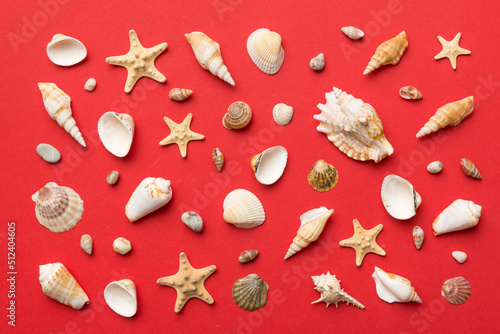 Summer time concept Flat lay composition with beautiful starfish and sea shells on colored table, top view