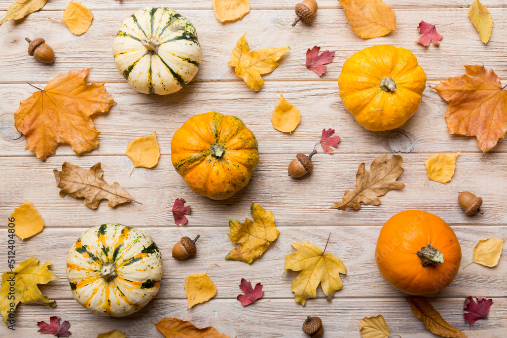 Autumn composition. Pattern made of dried leaves and other design accessories on table. Flat lay, top view Autumn composition. Pattern made of dried leaves and other design accessories on table. Flat lay, top view