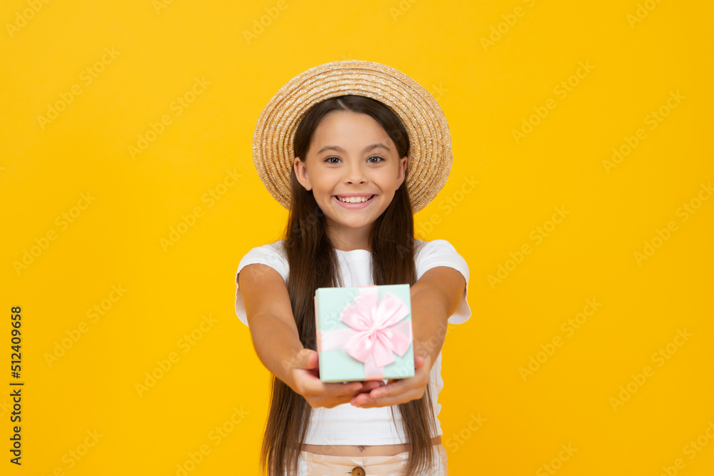 cheerful teen child hold present box on yellow background cheerful teen child hold present box on yellow background