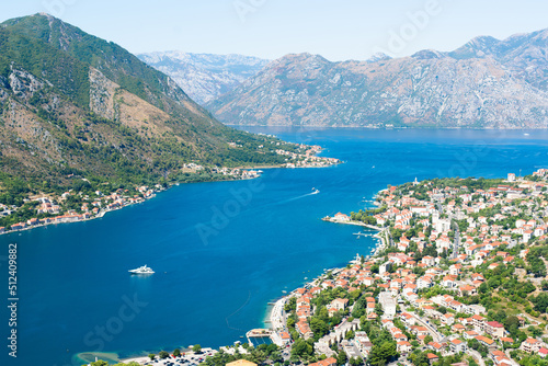 Beautiful seascape overlooking the blue sea, mountains and the old town. City of Kotor, Montenegro. Selective focus.