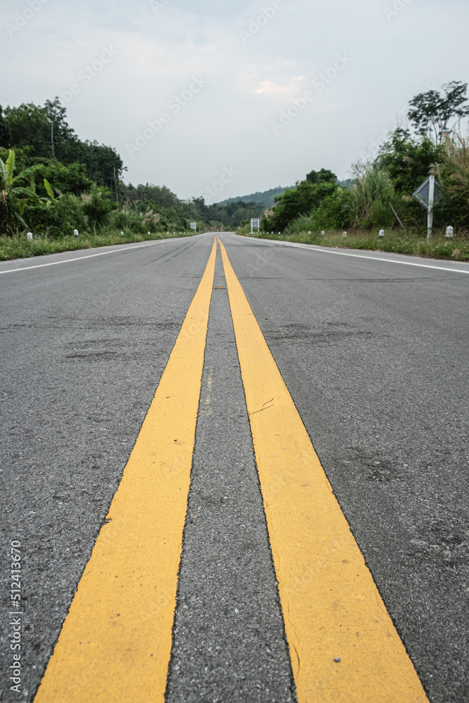 The yellow line divides the route.selective focus The yellow line divides the route.selective focus