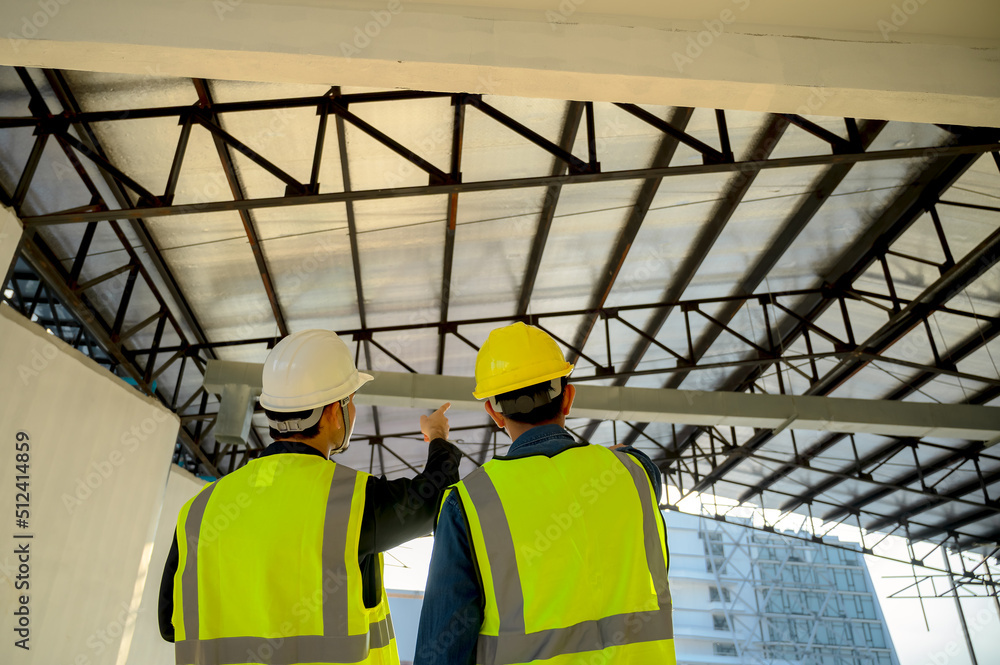 Civil Engineer and Construction Supervisor inspect the internal construction of building at construction site. Construction engineers or architect and Foreman inspect the construction inside building. Civil Engineer and Construction Supervisor inspect the internal construction of building at construction site. Construction engineers or architect and Foreman inspect the construction inside building.