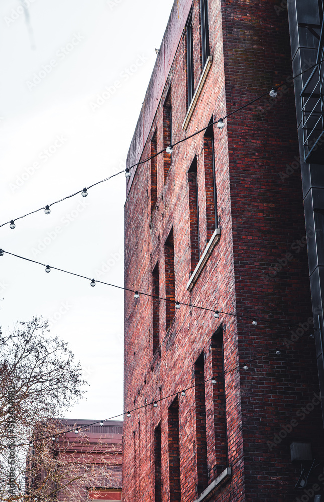 Fototapeta premium old brick building with hanging lights