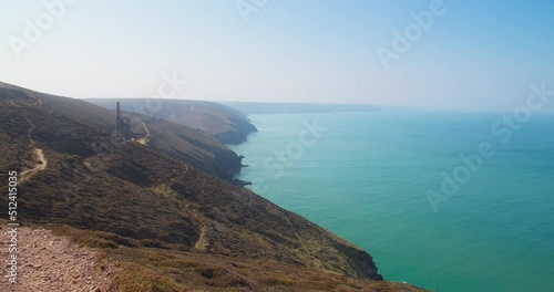 North Cornwall Coast With Chapel Porth Seascape Overlooking The Atlantic Ocean Near Wheal Coates Tin Mine Ruins In Cornwall, UK. Wide Shot photo