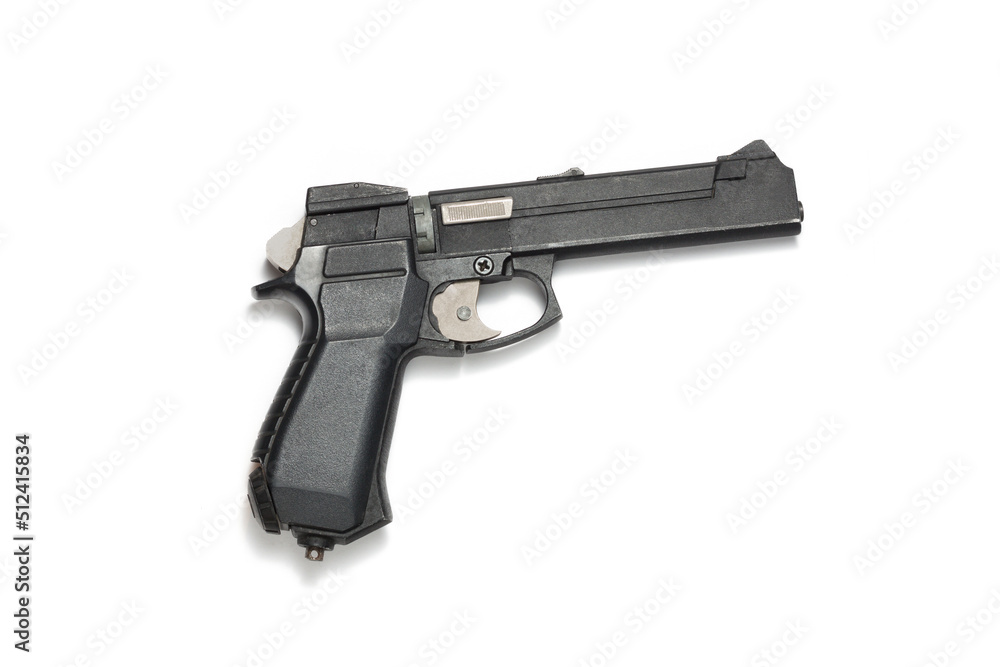 Black gas gun on a white background in close-up. Air gun pneumatic weapon