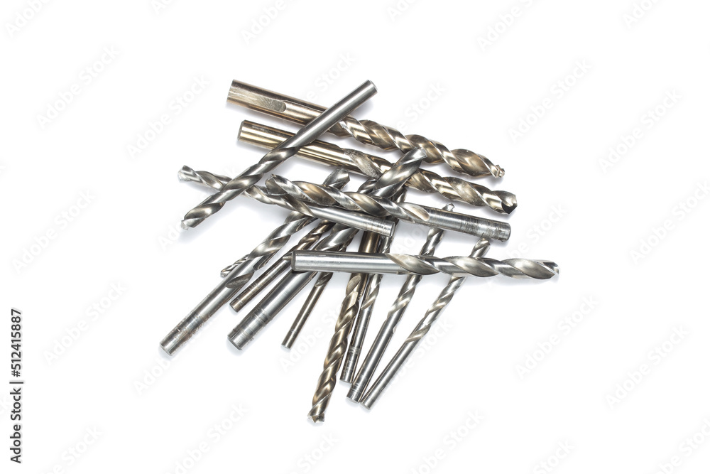 a set of drill bit of different size macro shooting on a white background. space for text a set of drill bit of different size macro shooting on a white background. space for text