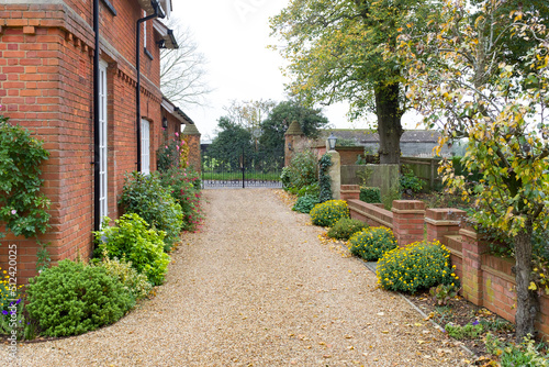 Large UK house and garden with gravel driveway photo