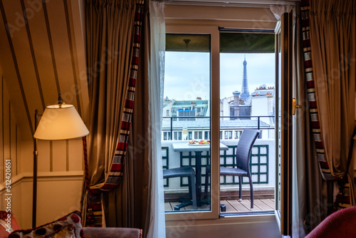 Photography Cosy Paris hotel room with balcony and beautiful view at Eiffel tower and city