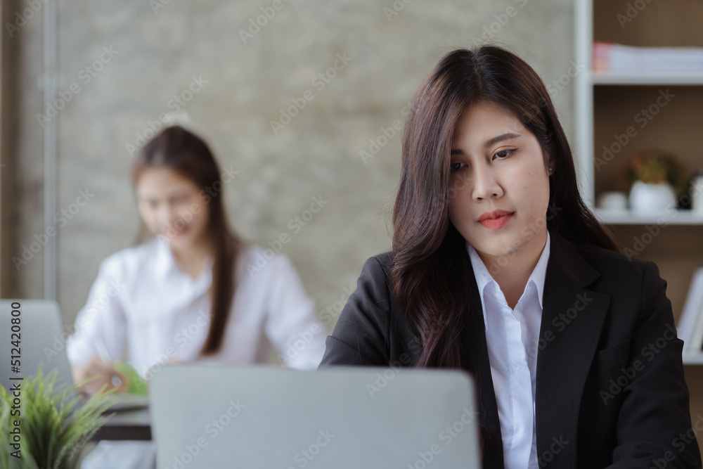 Asian women working in the office, young Asian business women as business executives, founding and running start-up executives, young female business leaders. Startup business concept. Asian women working in the office, young Asian business women as business executives, founding and running start-up executives, young female business leaders. Startup business concept.