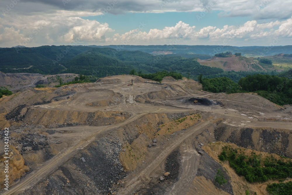 Mountaintop Strip Mining with Green Mountains in Background with Blue Sky Mountaintop Strip Mining with Green Mountains in Background with Blue Sky