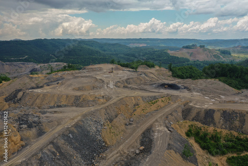 Mountaintop Strip Mining with Green Mountains in Background with Blue Sky
