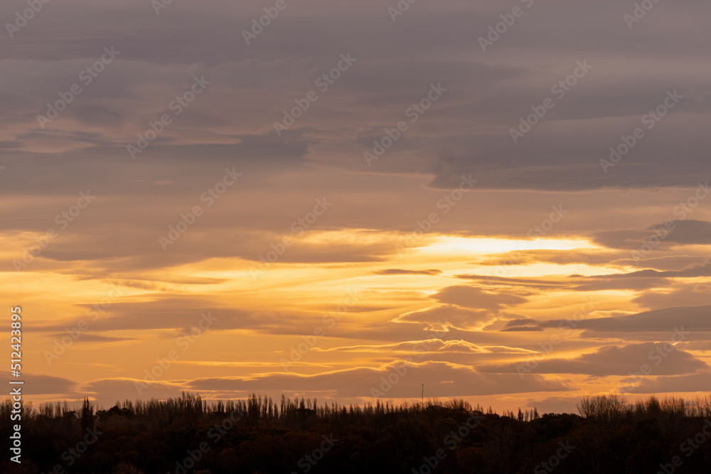 Cloudscape of beautiful sunset on a cloudy day during golden hour