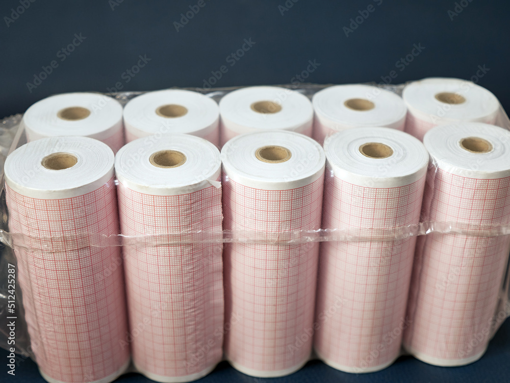 Rolls of paper for printing an electrocardiogram of the heart. Diagnosis of the heart. Rolls of paper for printing an electrocardiogram of the heart. Diagnosis of the heart.