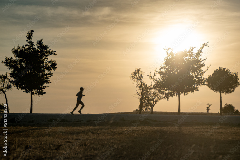 A man running in the park A man running in the park