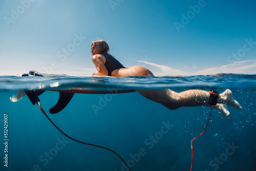 Photography Sporty surf girl in sexy bikini with surfboard, split view