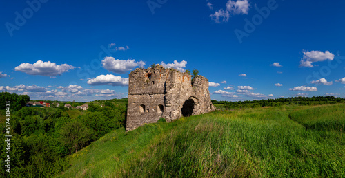 Remains and ruins of an old castle in Europe. UNESCO heritage in the Ukrainian village Sutkivtsi.