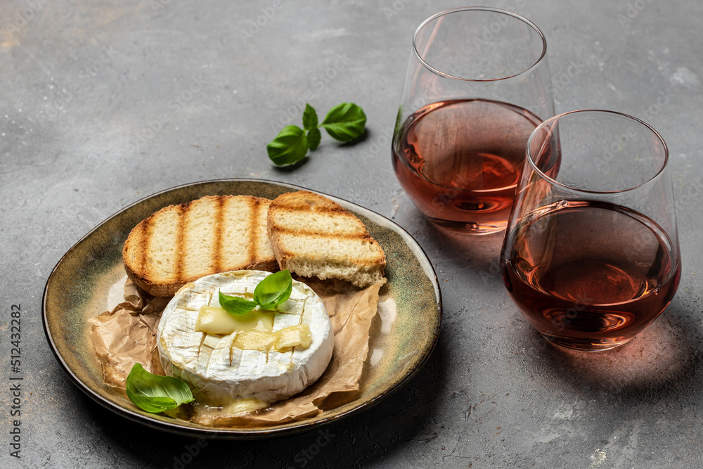 camembert cheese baked with with basil leaves and wine. banner, menu, recipe place for text, top view