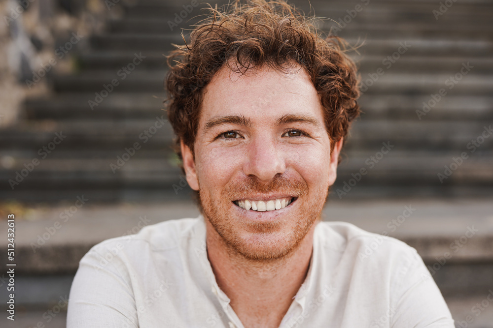 Happy redhead man smiling on camera outdoor Happy redhead man smiling on camera outdoor