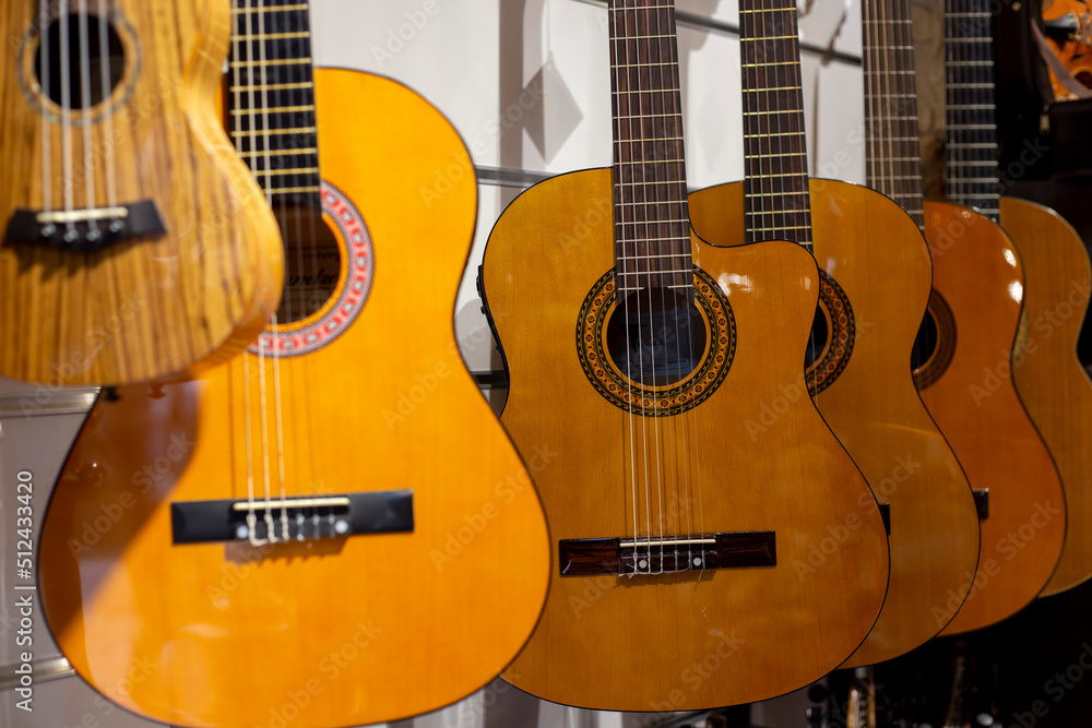 Obraz premium Classical nylon string guitars at showcase in music store