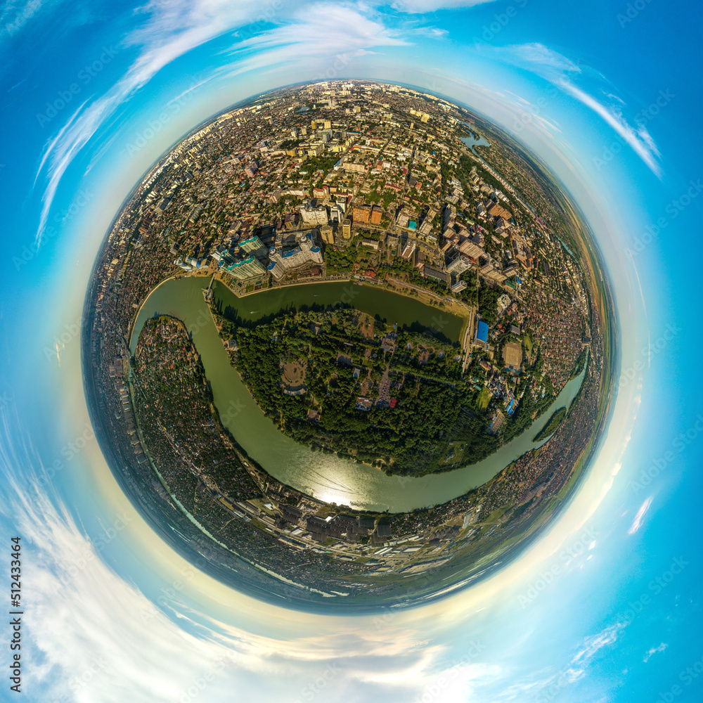 aerial minor planet view over the park of the 30th anniversary of the Victory on the banks of the Kuban river in the city of Krasnodar (South of Russia) on a sunny summer day