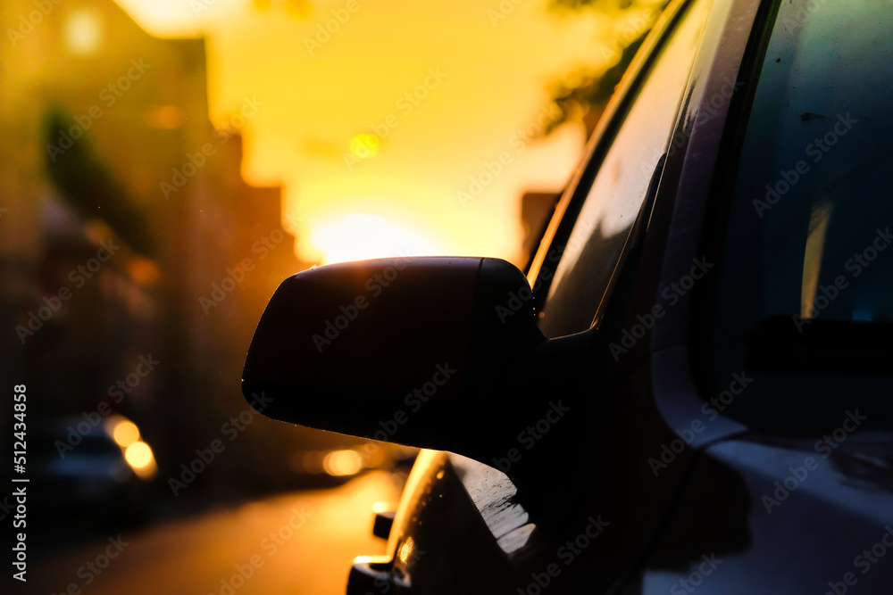 Sunset in the city and car, traffic in the city. Defocused Sunset in the city and car, traffic in the city. Defocused